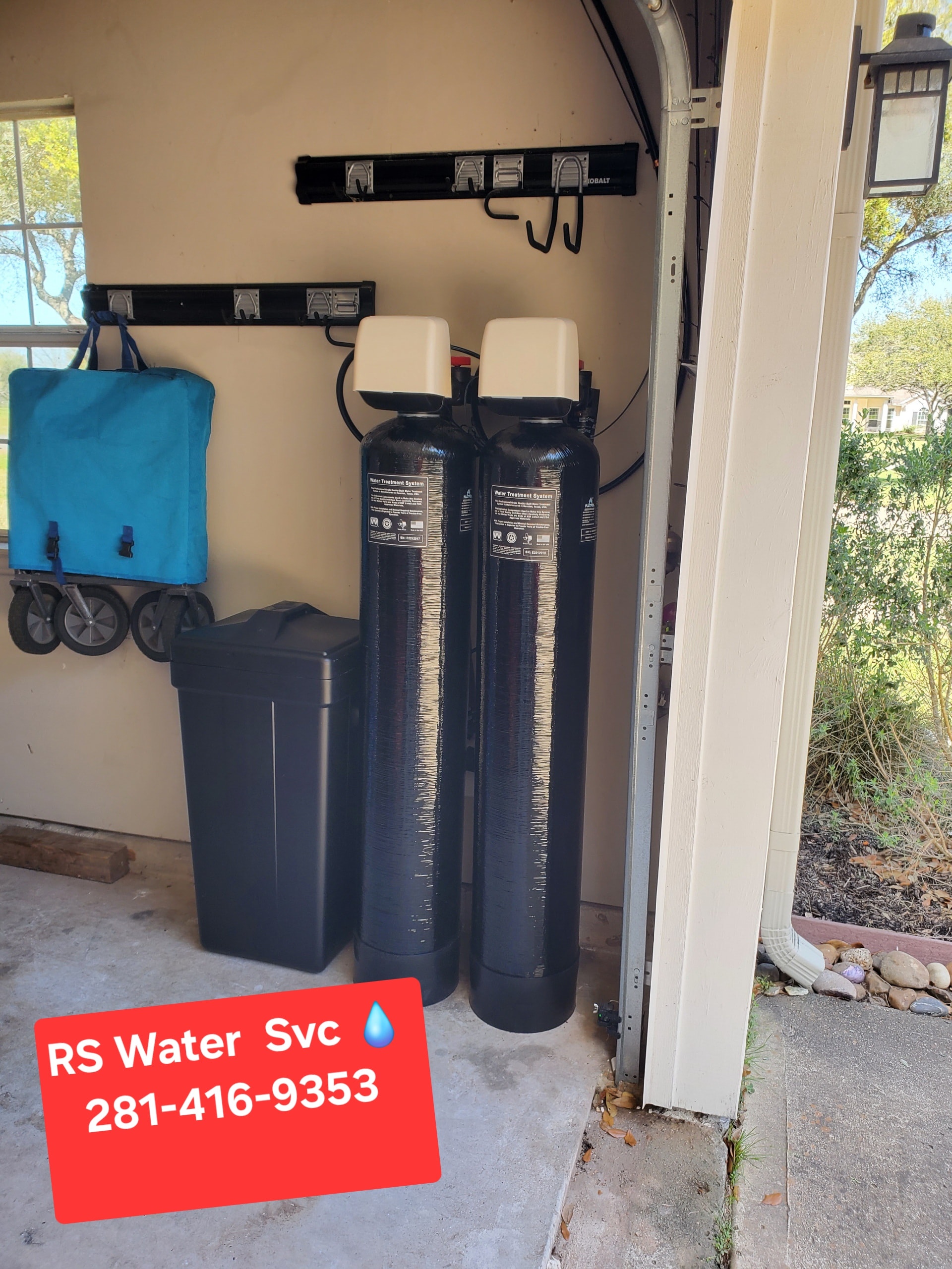 Water softener salt tank and brine tank installed in garage